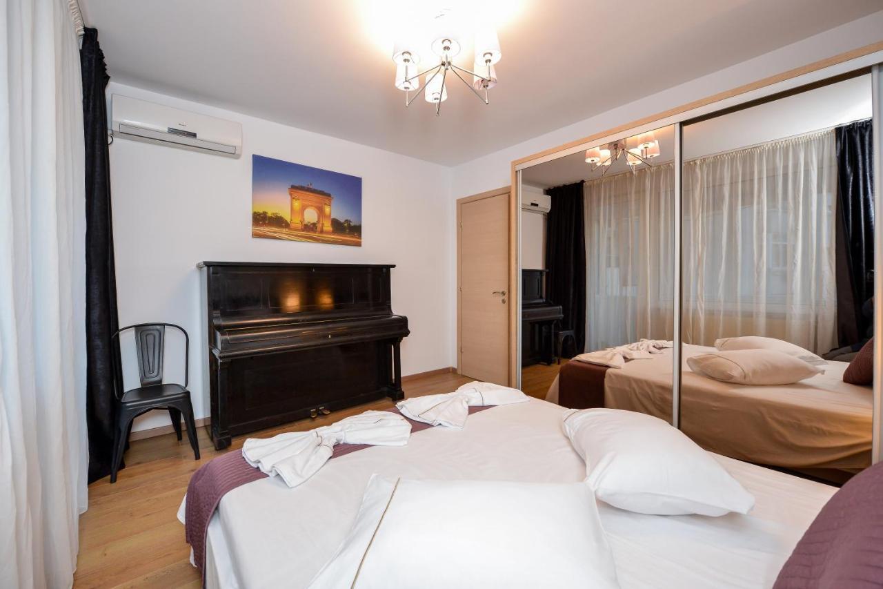 One By One - By Grand Accommodation Bucarest Esterno foto